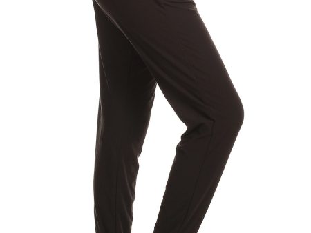 Solid color joggers with solid trim, drawstring waistband, waist pockets, and cuffed hems - Black on Sale